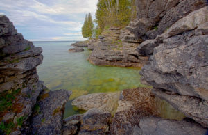 caves and rocks on lake