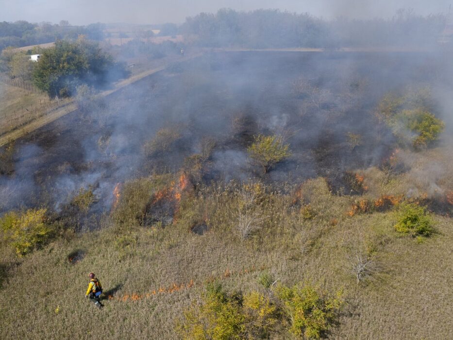 A team of Wisconsin DNR professionals conduct a prescribed burn at Southwest Grassland in the Driftless Area. Photo by Michael Kienz