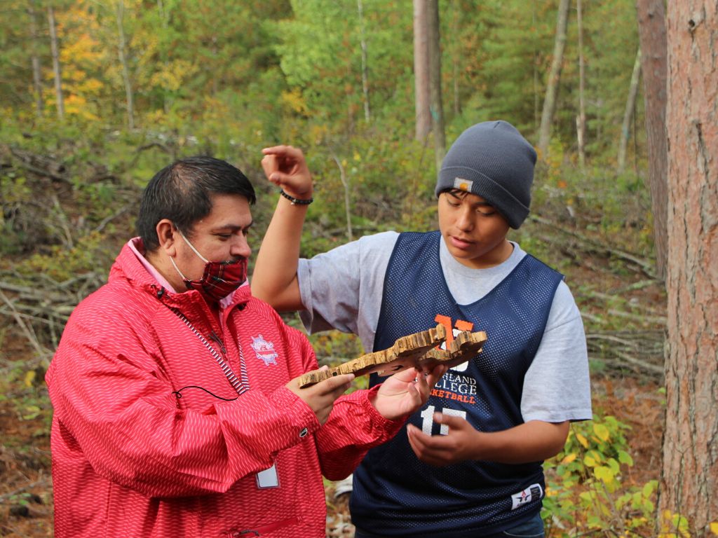 Brian Boyd, the Ojibwe culture teacher with Bayfield High School, with a student during a tour of Inch Lake State Natural Area by WDNR. Photo: Caitlin Williamson