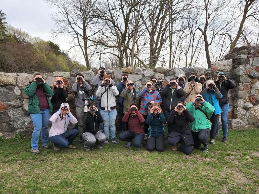 Team Yes We Pelican from the Feminist Bird Club poses with binoculars