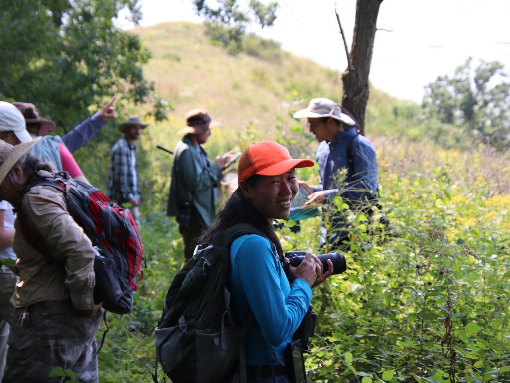 A photographer smiles during a Field Trip to Rush Creek State Natural Area. Photo by Marc Williams