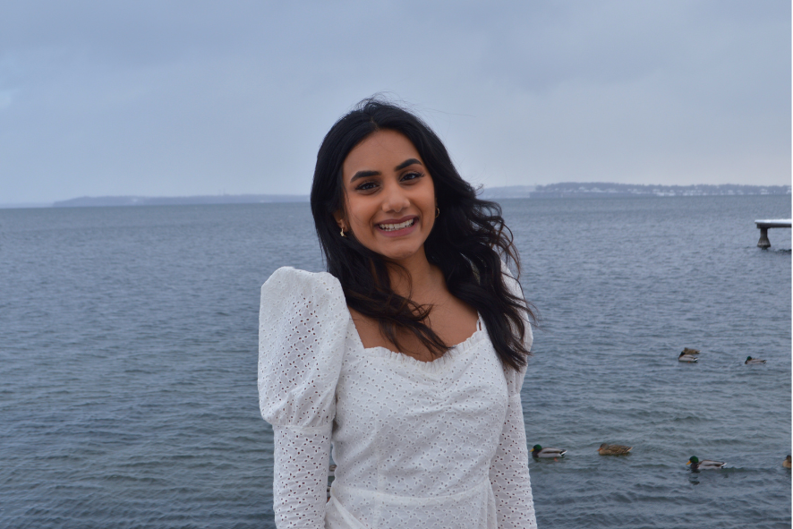 New Event and Donor Relations Coordinator, Soumi Gaddameedi in front of a winter lake.