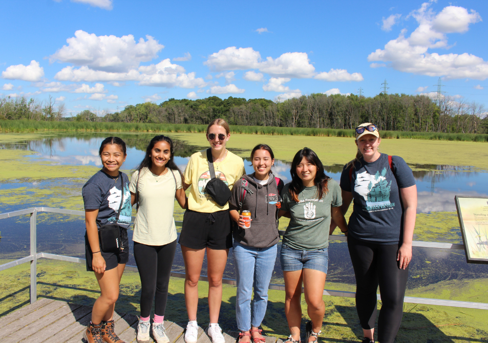The 2022 Cohort in the Diversity in Conservation Internship Program visited the Stroebe Island Marsh on the west shore of Little Lake Butte des Morts. Staff member Cait Williamson on the right.