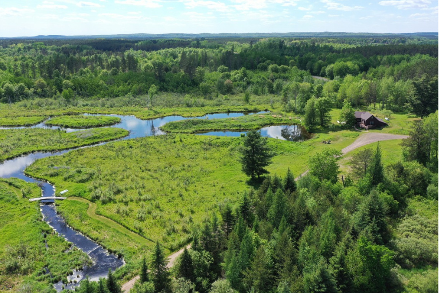 Ariel view of Damian Vraniak's private land with a house on it