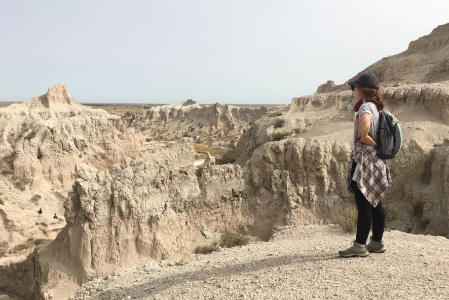 New Executive Assistant, Michaela on a hike in Badlands National Park.