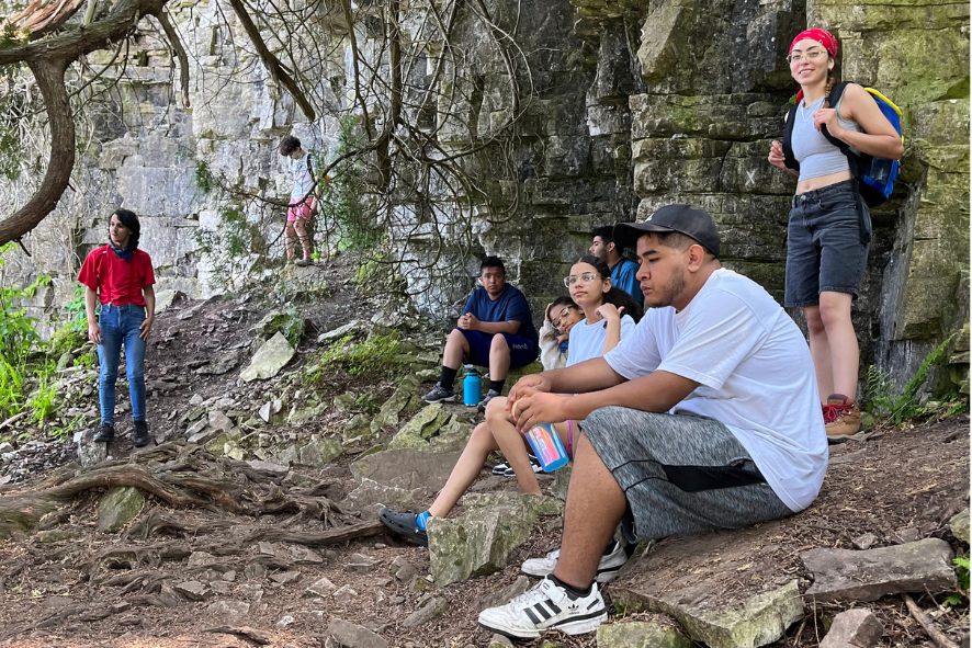 Escuela Verde students resting during a hike