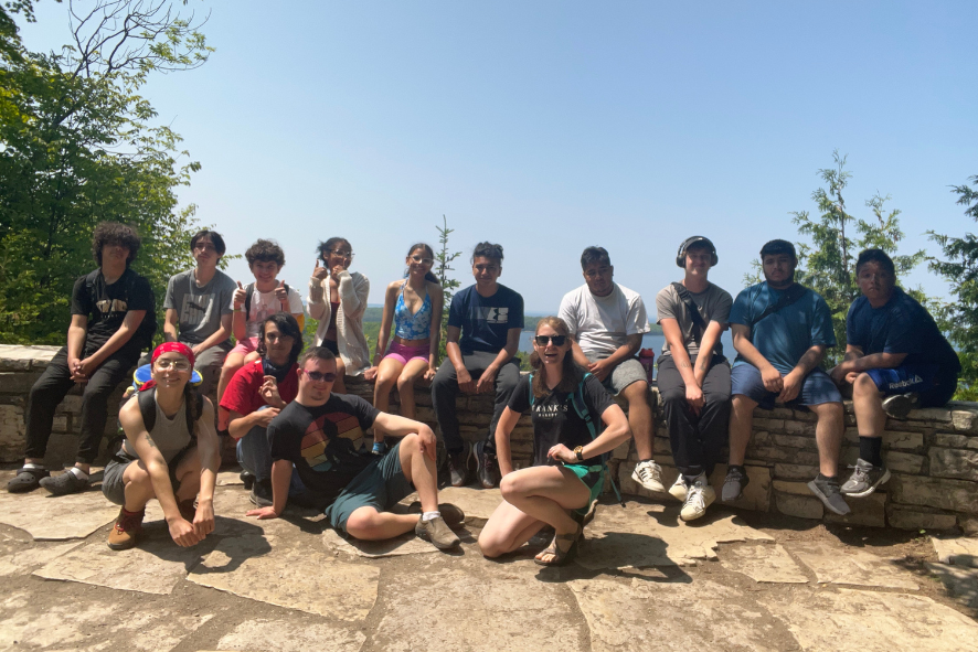 Escuela Verde students at a look out during a hike