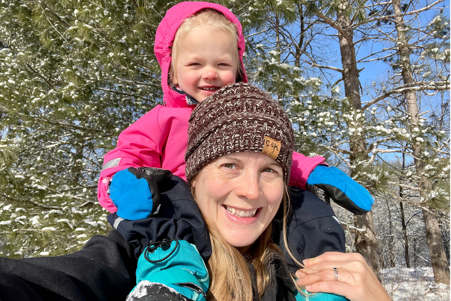New Grant Writer, Brenna, on a winter hike with her daughter.